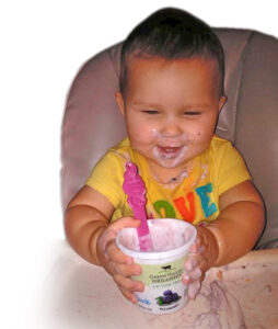Baby eating yogurt 