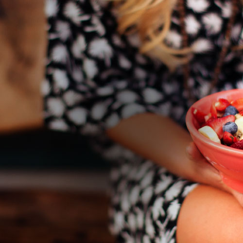 a person holding a smoothie bowl