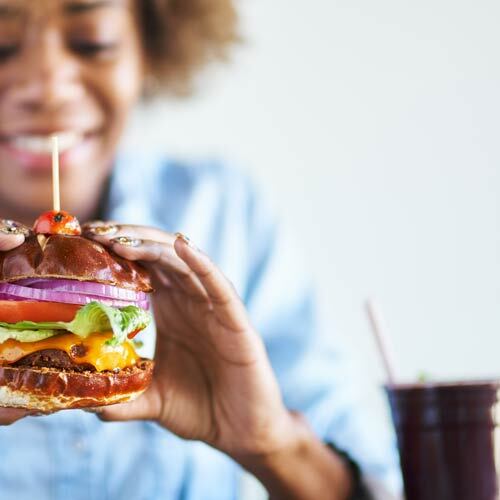 a person eating a burger