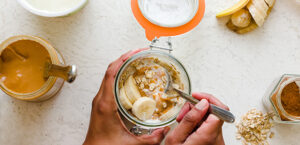 Jar of peanut butter overnight oats with spoon